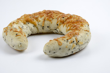 Fresh whole grain bread cut in half on white background