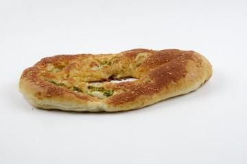 Fresh whole grain bread cut in half on white background