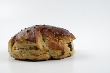 Fresh whole grain bread cut in half on white background