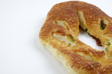Fresh whole grain bread cut in half on white background