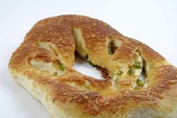 Fresh whole grain bread cut in half on white background