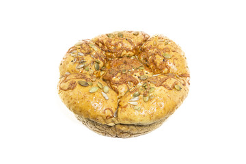 Fresh whole grain bread cut in half on white background