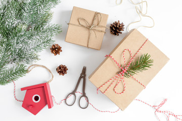 packaging christmas gifts in boxes on white background top view