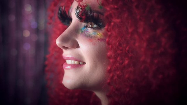 4k Disco Redhead Sexy Woman Posing with Colourful Make-up and Eyelashes