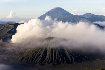 Wide angle view of Mount Bromo in Tengger Semeru National Park, East Java, Indonesia during beutiful sunrise with the valley full of sea cloud.