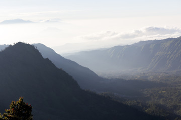 Wide angle view of Mount Bromo in Tengger Semeru National Park, East Java, Indonesia during beutiful sunrise with the valley full of sea cloud.