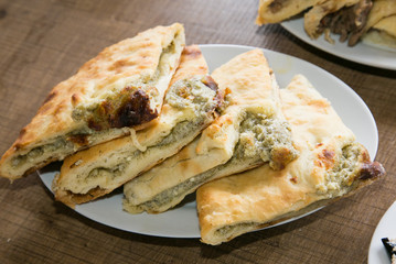 Traditional Georgian cheese and millet pie -khachapuri. The nati