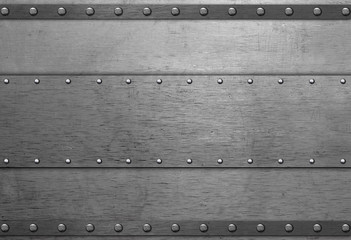 Metal plate with rivets on steel background