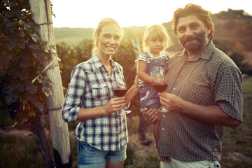Wine grower family in vineyard