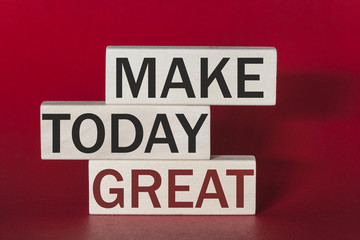 Make today great. Motivational quote written on wooden tiles