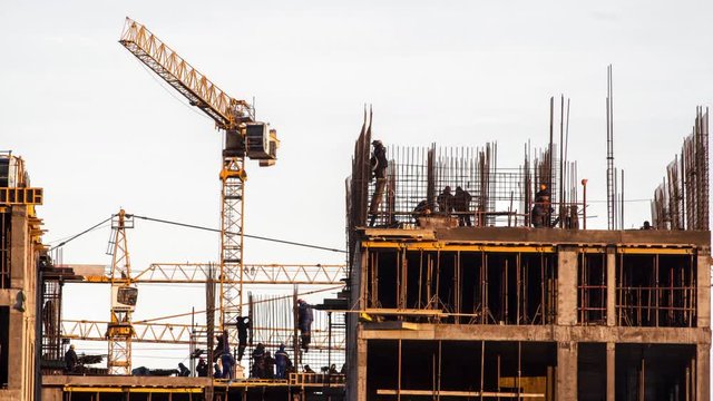 construction workers working on building, real estate development time lapse
