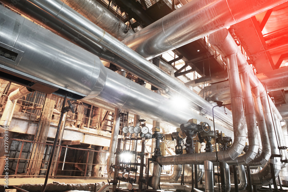 Wall mural equipment, cables and piping as found inside of a modern industr