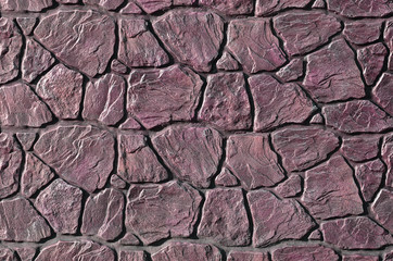 Stone fence texture - building feature. Texture of concrete fence with relief and texture like a...