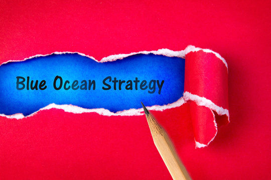 Blue ocean strategy word on Torn red Paper