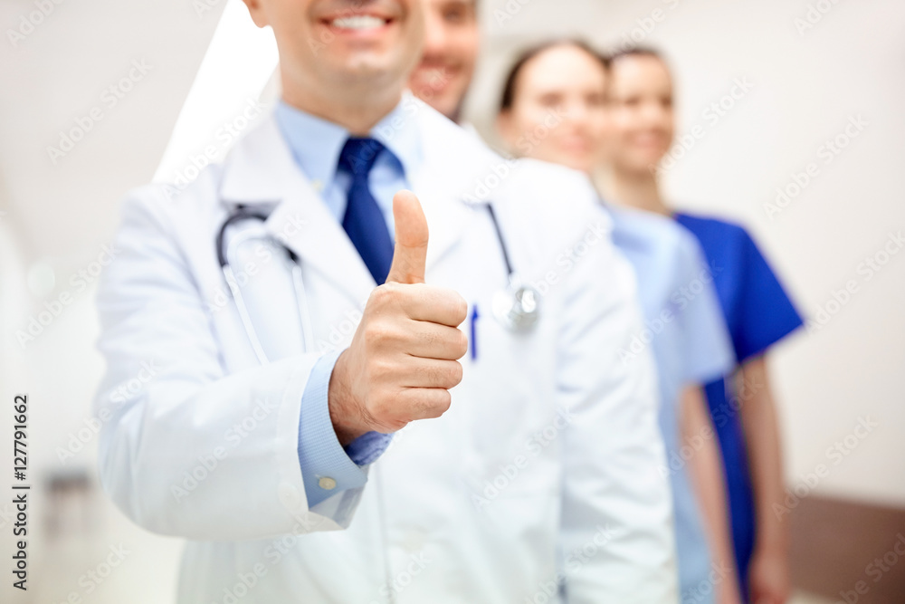 Wall mural close up of doctors at hospital showing thumbs