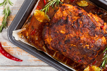 Whole roast shoulder of pulled pork in roasting pan