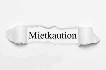 Mietkaution auf weißen gerissenen Papier