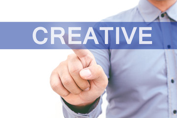 Businessman hand touching creative on virtual screen