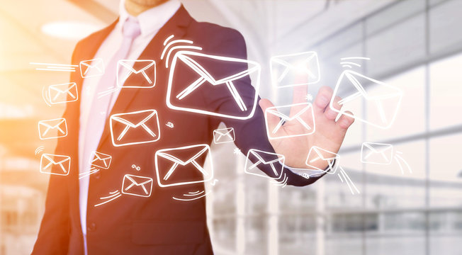Businessman touching technology interface with email icons