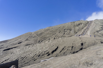 Landscape Man ride a horse go to Bromo volcano while eruption, Java, Indonesia,soft focus and motion blur