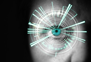 Eye of a woman with digital interface in front of it