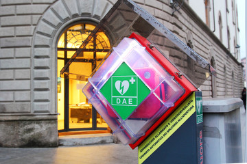 Station of an automated external defibrillator (AED) in an Italian town (Lecco) - obrazy, fototapety, plakaty