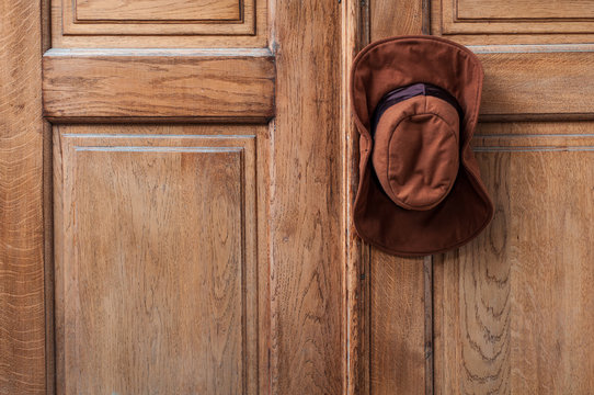 Cowboy hat hanging on the door handle