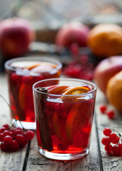 Winter warm drink. Homemade Hot Delicious Red Sangria with Berries, Oranges, Spices and Apples. Mulled wine or punch.
