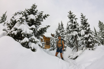Male tourist with a backpack, with a naked torso and legs is amo
