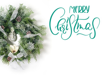 Christmas wreath on white background. Calligraphy lettering