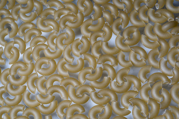 Abstract background of pasta in the shape of a horn