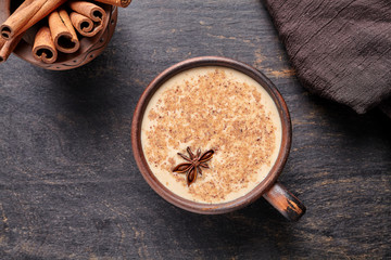 Masala tea chai latte traditional warm Indian sweet milk spiced drink, ginger, cinammon sticks,...