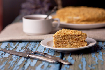 Honey cake on a wooden background