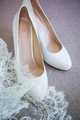 closeup white wedding shoes