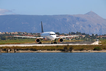 Fototapeta na wymiar passenger airplane on Corfu airport Greece