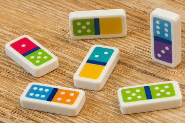 Domino pieces on the  wooden table background