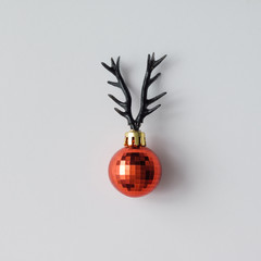 Christmas decoration with reindeer antlers. Minimal holiday conc © Zamurovic Brothers