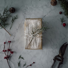 DIY Christmas gift wrapping on marble background. Minimal concep