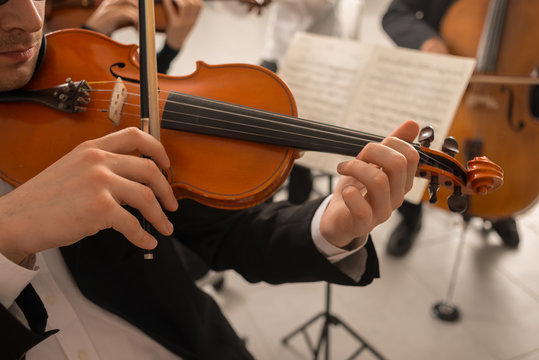 Violinist performing with orchestra