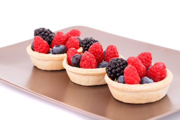 Fresh ripe berries in tartlets