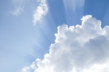 Blue sky with clouds and light of the sun