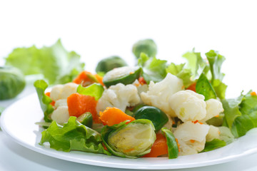 salad of lettuce, cauliflower and Brussels sprouts with a pumpkin
