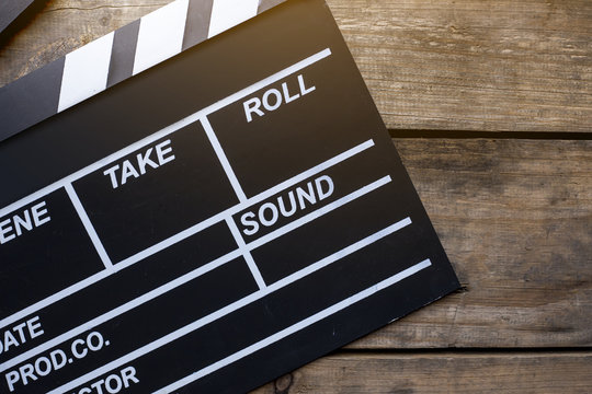 movie clapper on wood table