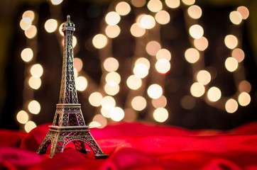 Fototapeta na wymiar Christmas card. Holiday in Paris. Eiffel Tower on the bright blu
