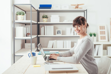 Smiling businesswoman in her office