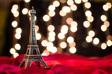 Fototapeta na wymiar Christmas card. Holiday in Paris. Eiffel Tower on the bright blu