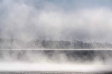 Morning fog over freshly plowed field