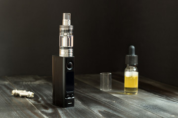 Vape or e-cigarette. Vaping set on the table.