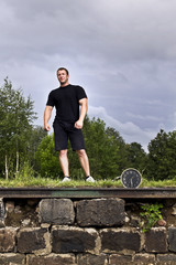 Fototapeta premium Sportsman and clock