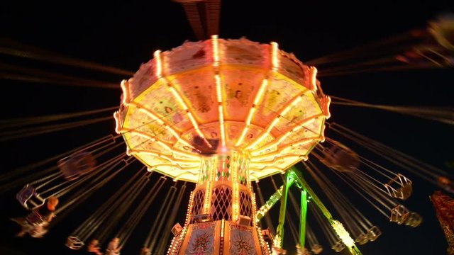 A classic carousel (super wide shot) on a funfair like Oktoberfest. All recognizable people or names/logos are blurred out by motion or hand.
11059
